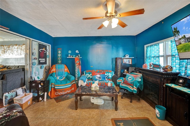 7908 Coral Blvd, Miramar, FL 33023 - tiled living area with ceiling fan and a textured ceiling