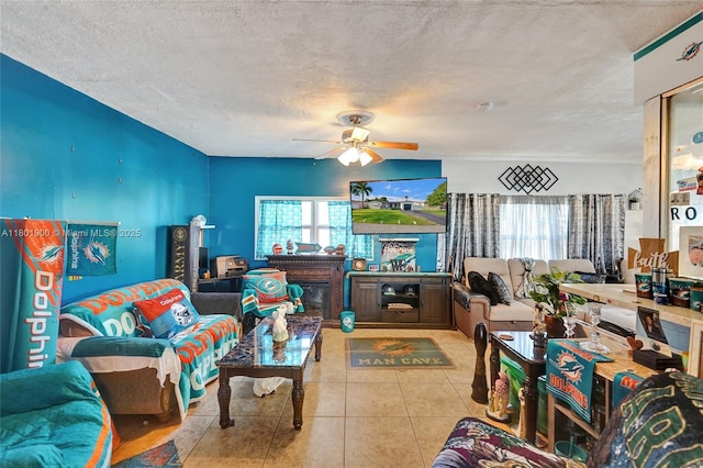 7908 Coral Blvd, Miramar, FL 33023 - tiled living area featuring a ceiling fan, a textured ceiling, and a glass covered fireplace