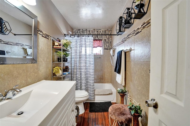 7908 Coral Blvd, Miramar, FL 33023 - full bath with tile walls, vanity, toilet, shower / tub combo, and wood finished floors