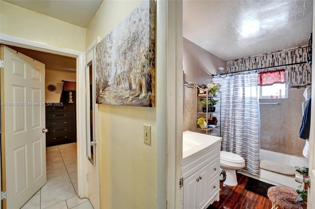 7908 Coral Blvd, Miramar, FL 33023 - bathroom with vanity, shower / bath combo with shower curtain, toilet, and tile patterned flooring