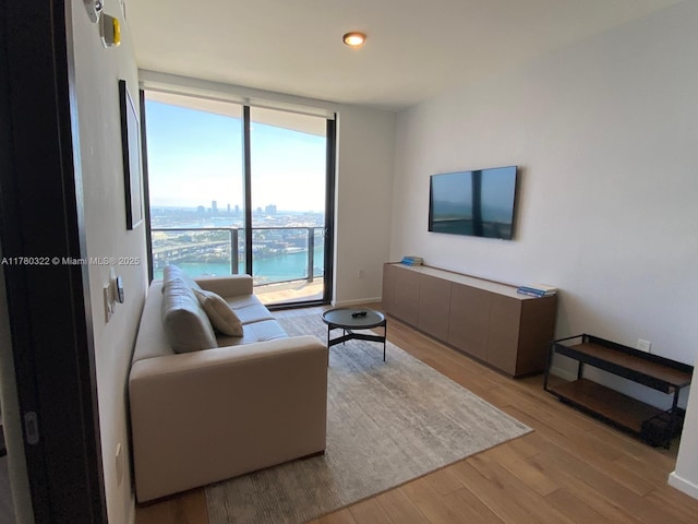 398 NE 5th St Unit 2910, Miami, FL 33132 - living area featuring light wood-style floors, expansive windows, and recessed lighting