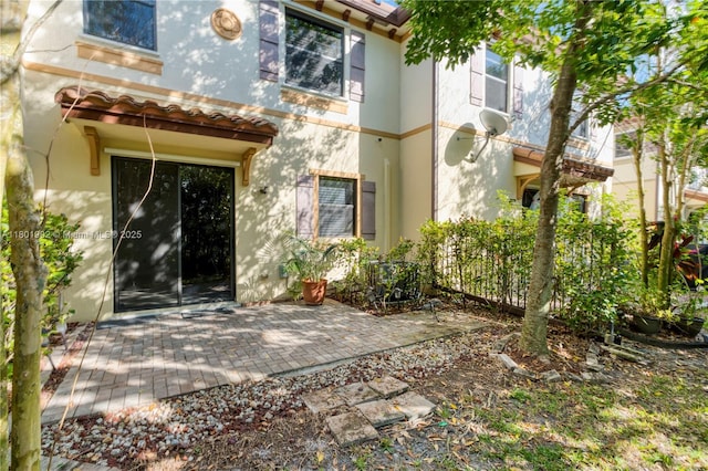 6973 Broadland Way, Coconut Creek, FL 33073 - property entrance featuring a patio and stucco siding