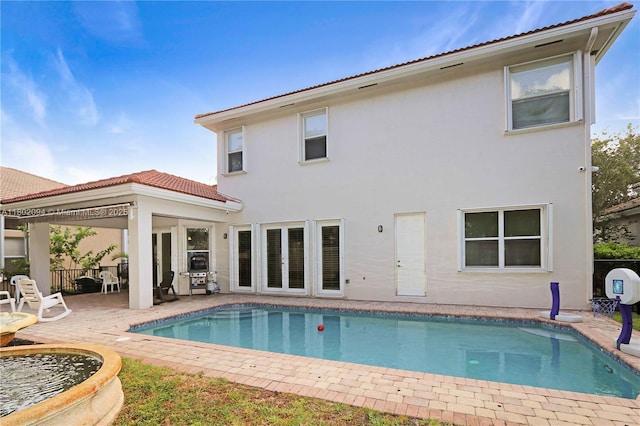 4968 SW 183rd Ave, Miramar, FL 33029 - back of property featuring stucco siding, a patio area, and a tile roof