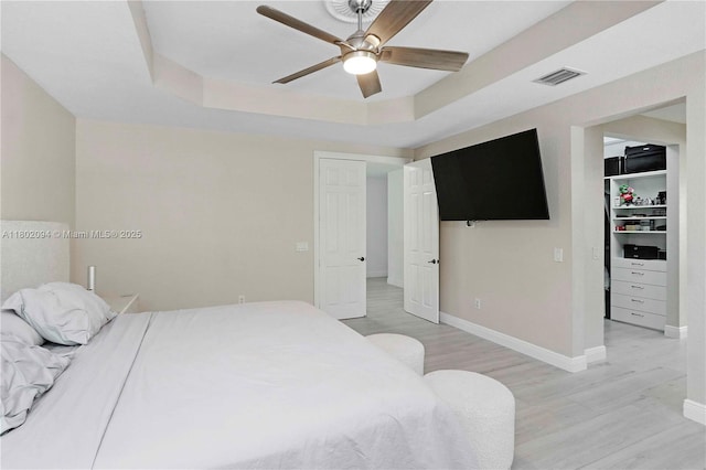 4968 SW 183rd Ave, Miramar, FL 33029 - bedroom featuring light wood-type flooring, a spacious closet, a closet, baseboards, and ceiling fan