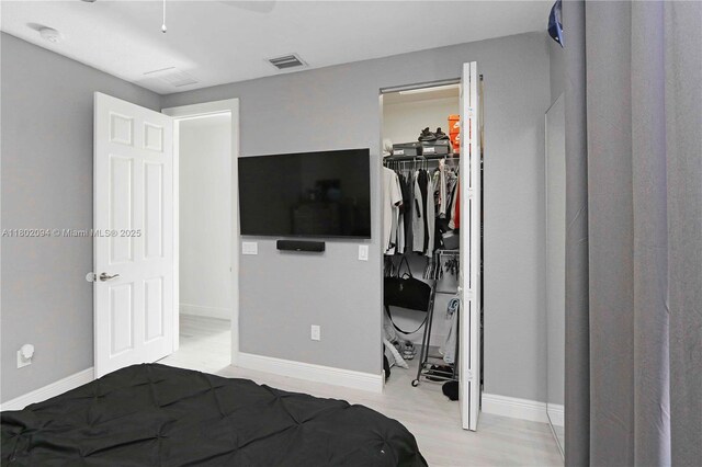 4968 SW 183rd Ave, Miramar, FL 33029 - bedroom with a closet, wood finished floors, baseboards, and a spacious closet