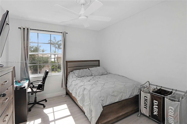 4968 SW 183rd Ave, Miramar, FL 33029 - bedroom featuring light wood-style floors, baseboards, ceiling fan, and a desk