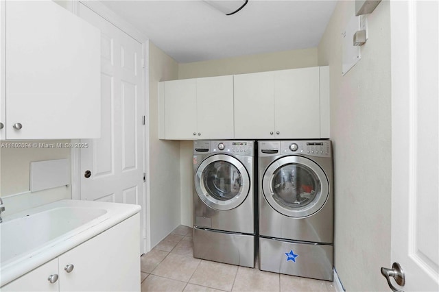 4968 SW 183rd Ave, Miramar, FL 33029 - clothes washing area featuring cabinet space, washer and dryer, and light tile patterned floors