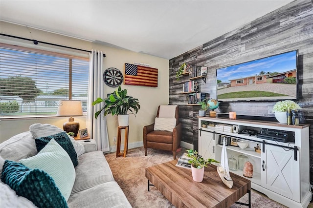 2435 Wilson St, Hollywood, FL 33020 - carpeted living area with an accent wall and baseboards