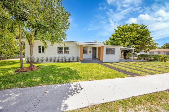 5410 SW 2nd St, Miami, FL 33134 - ranch-style house featuring a front yard, a carport, driveway, and brick siding