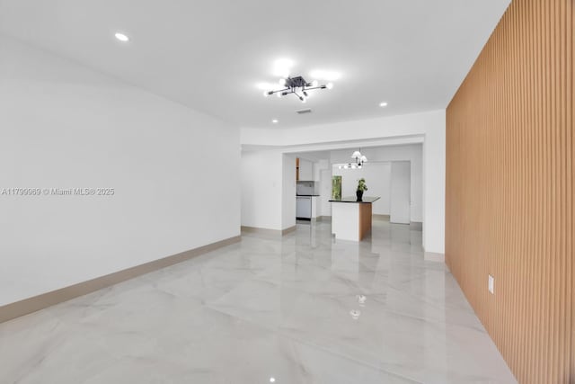 5410 SW 2nd St, Miami, FL 33134 - unfurnished room featuring a chandelier, light marble finish flooring, recessed lighting, and wooden walls