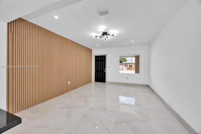 5410 SW 2nd St, Miami, FL 33134 - unfurnished room with light marble finish floors, recessed lighting, and wood walls