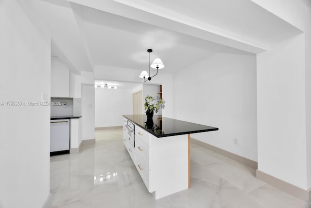 5410 SW 2nd St, Miami, FL 33134 - kitchen with white dishwasher, light marble finish flooring, dark countertops, white cabinets, and baseboards