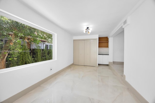 5410 SW 2nd St, Miami, FL 33134 - empty room featuring light marble finish floors and baseboards