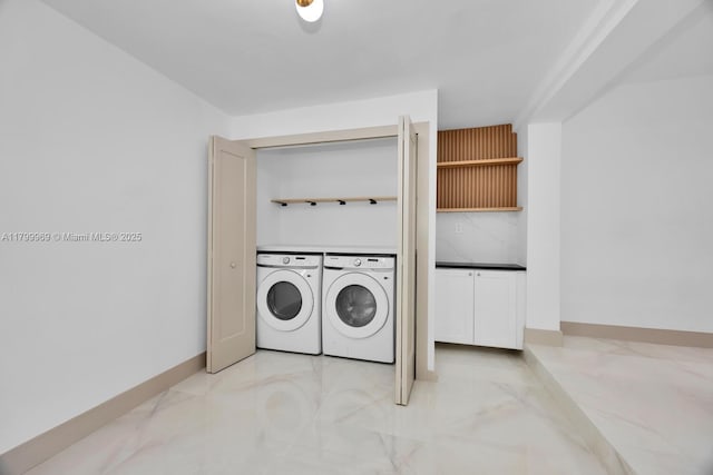 5410 SW 2nd St, Miami, FL 33134 - washroom featuring separate washer and dryer, light marble finish floors, and baseboards