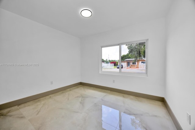 5410 SW 2nd St, Miami, FL 33134 - empty room featuring light marble finish flooring and baseboards