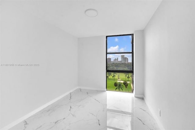 20335 W Country Club Dr Unit 1108, Aventura, FL 33180 - unfurnished room featuring marble tiled floors, baseboards, a view of city, and a wall of windows