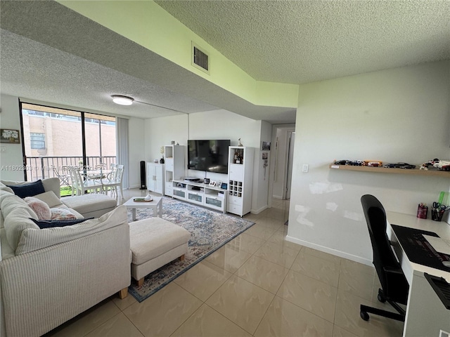 3550 Blue Lake Dr Unit 501, Pompano Beach, FL 33064 - living room with a textured ceiling, baseboards, and a desk
