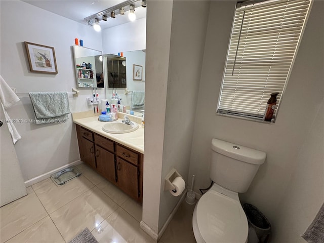 3550 Blue Lake Dr Unit 501, Pompano Beach, FL 33064 - bathroom featuring toilet, vanity, and baseboards