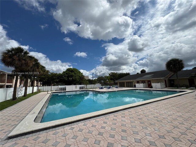 3550 Blue Lake Dr Unit 501, Pompano Beach, FL 33064 - community pool featuring fence and a patio