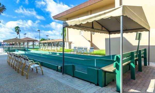 view of patio / terrace with a game area and a gazebo