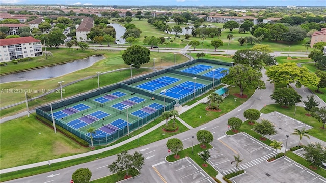 drone / aerial view of a large body of water and a local golf course