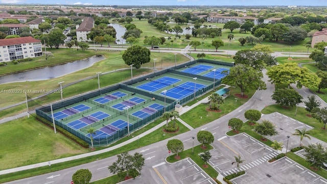 drone / aerial view of a large body of water and a golf course