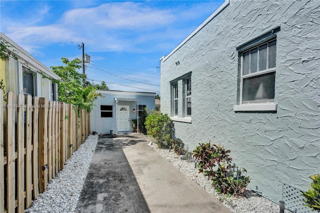 38 NW 47th Ter, Miami, FL 33127 - view of side of property with fence and stucco siding