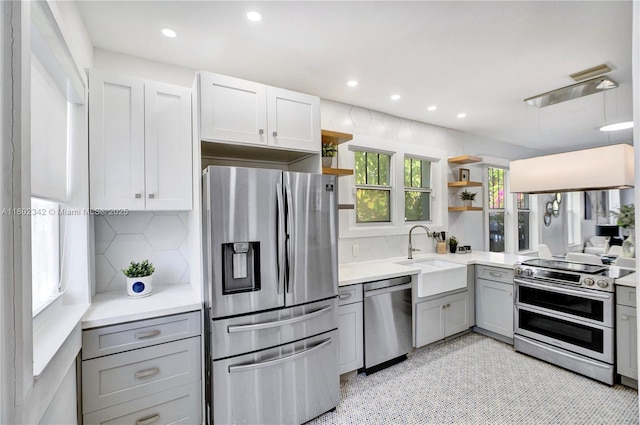 38 NW 47th Ter, Miami, FL 33127 - kitchen with appliances with stainless steel finishes, a sink, open shelves, gray cabinetry, and light countertops