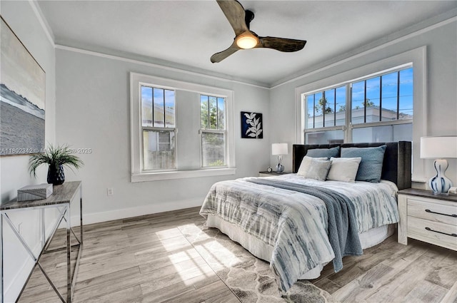 38 NW 47th Ter, Miami, FL 33127 - bedroom featuring multiple windows, crown molding, wood finished floors, and baseboards