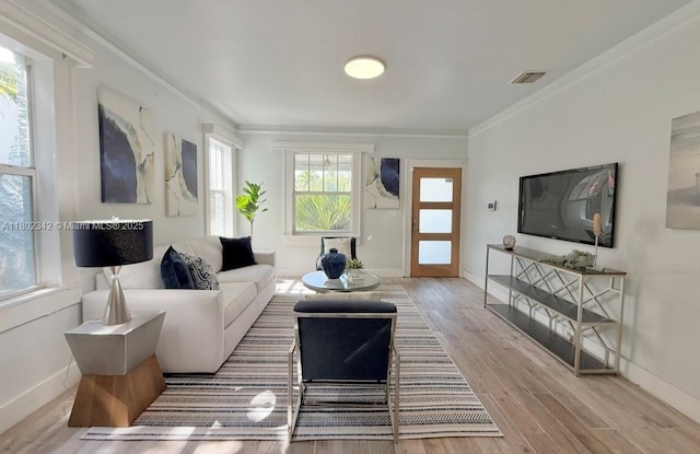 38 NW 47th Ter, Miami, FL 33127 - living area featuring crown molding, wood finished floors, and baseboards