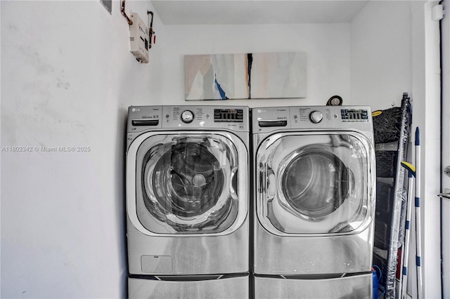 38 NW 47th Ter, Miami, FL 33127 - clothes washing area featuring washing machine and dryer