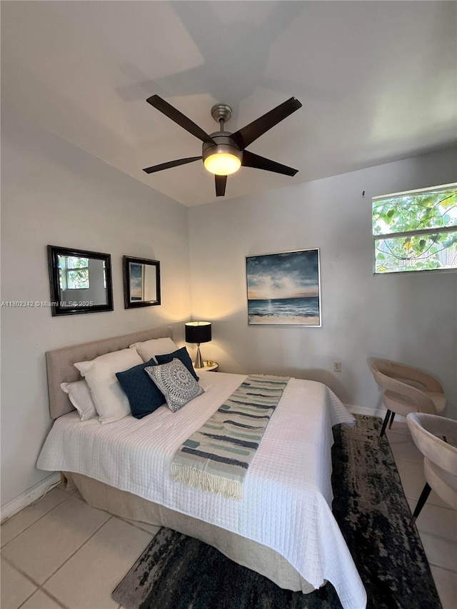 38 NW 47th Ter, Miami, FL 33127 - tiled bedroom with ceiling fan and baseboards