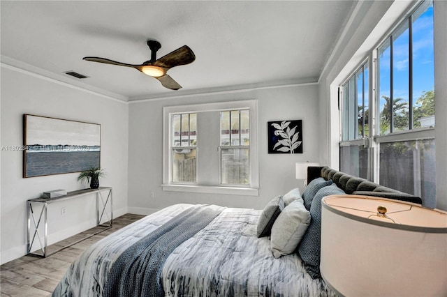 38 NW 47th Ter, Miami, FL 33127 - bedroom featuring crown molding, wood finished floors, baseboards, and ceiling fan