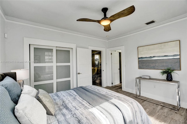 38 NW 47th Ter, Miami, FL 33127 - bedroom featuring wood finished floors, baseboards, ornamental molding, and a ceiling fan