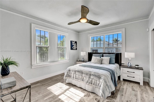 38 NW 47th Ter, Miami, FL 33127 - bedroom featuring ornamental molding, wood finished floors, baseboards, and a ceiling fan