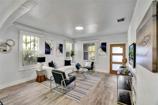38 NW 47th Ter, Miami, FL 33127 - living area featuring wood finished floors, baseboards, and ornamental molding