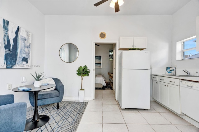 38 NW 47th Ter, Miami, FL 33127 - kitchen featuring white appliances, a sink, a ceiling fan, white cabinetry, and light tile patterned flooring