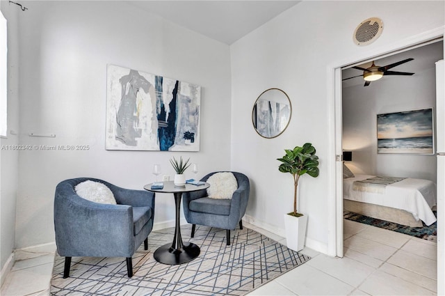 38 NW 47th Ter, Miami, FL 33127 - living area featuring baseboards, a ceiling fan, and tile patterned flooring