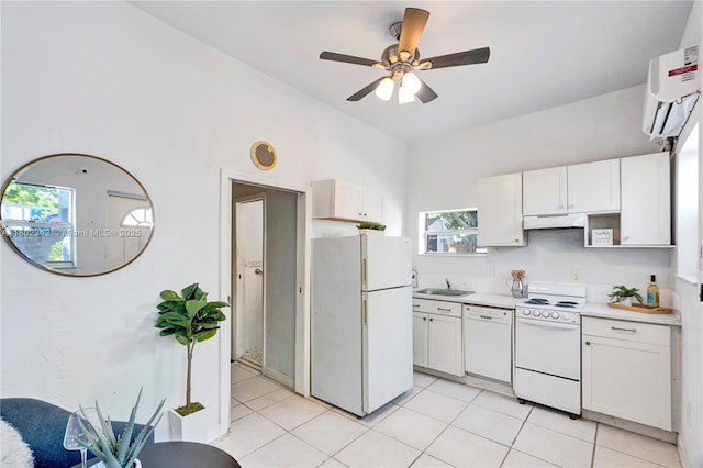 38 NW 47th Ter, Miami, FL 33127 - kitchen with white appliances, white cabinets, light countertops, and ceiling fan