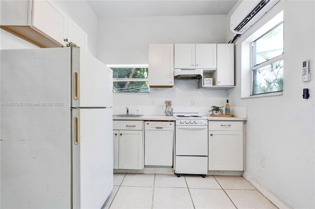 38 NW 47th Ter, Miami, FL 33127 - kitchen featuring white appliances, a sink, an AC wall unit, and healthy amount of natural light