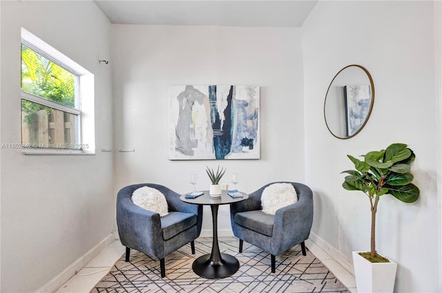 38 NW 47th Ter, Miami, FL 33127 - sitting room with baseboards and light tile patterned floors