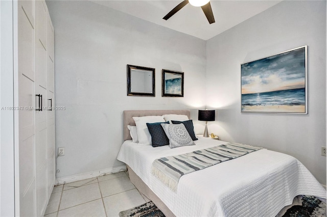 38 NW 47th Ter, Miami, FL 33127 - bedroom featuring baseboards, light tile patterned floors, and ceiling fan