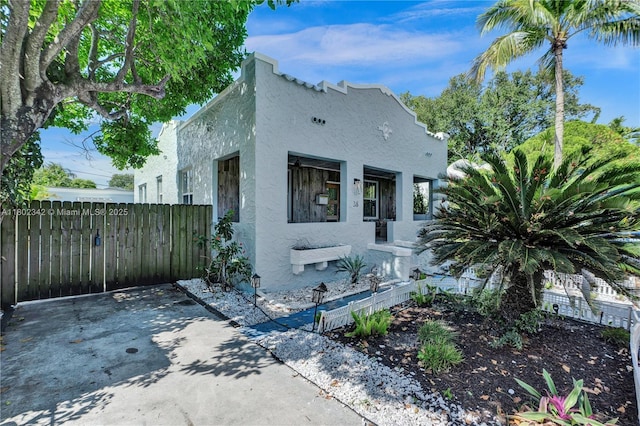 38 NW 47th Ter, Miami, FL 33127 - view of front of house with stucco siding and fence