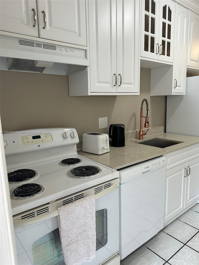2600 S Ocean Dr Unit S113, Hollywood, FL 33019 - kitchen featuring white appliances, under cabinet range hood, a sink, and white cabinets