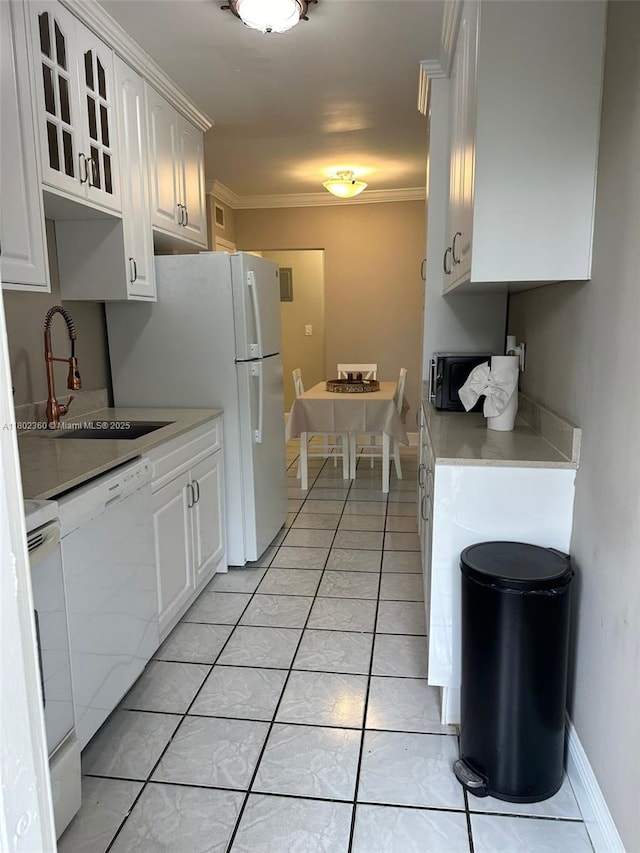 2600 S Ocean Dr Unit S113, Hollywood, FL 33019 - kitchen featuring white appliances, a sink, light countertops, glass insert cabinets, and white cabinets
