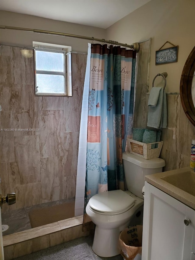 2600 S Ocean Dr Unit S113, Hollywood, FL 33019 - bathroom featuring a tile shower, toilet, and vanity