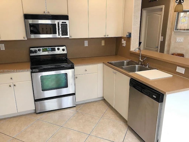 8753 SW 3rd Ln, Miami, FL 33174 - kitchen with stainless steel appliances, a sink, and white cabinets