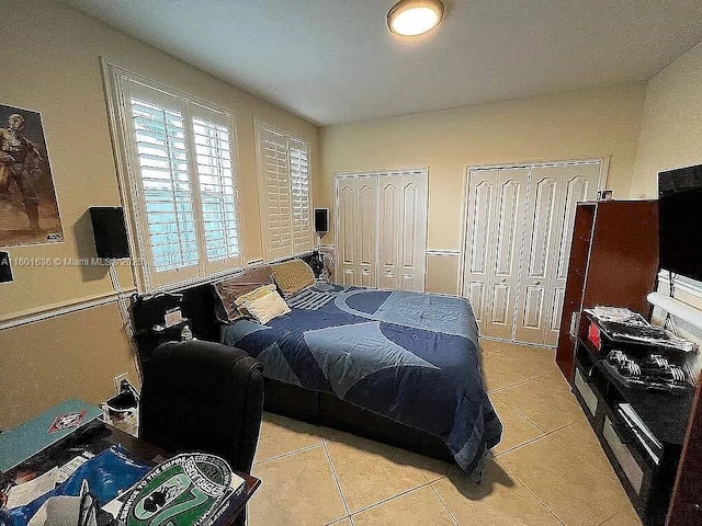 8753 SW 3rd Ln, Miami, FL 33174 - bedroom featuring multiple closets and light tile patterned flooring