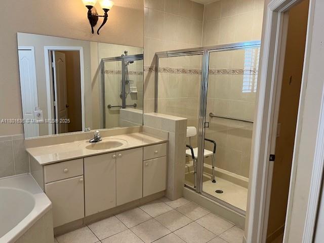 8753 SW 3rd Ln, Miami, FL 33174 - full bathroom featuring a stall shower, tile patterned flooring, a bath, and vanity