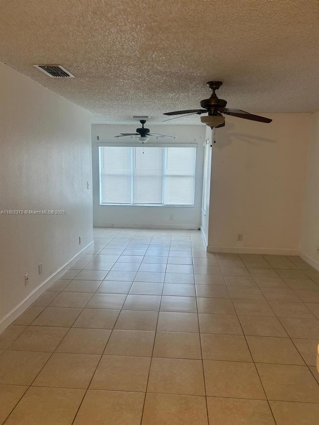 3310 N Pinewalk Dr N Unit 1814, Margate, FL 33063 - empty room featuring light tile patterned flooring, ceiling fan, and a textured ceiling